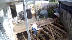 Woman Holding Her Dog Falls Through Deck After Stepping on a Plank - Videoclip.bg